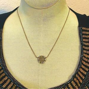 Dream catcher necklace in gold tone metal with crystal woven beads